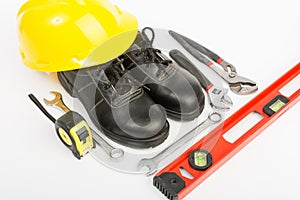 Yellow hard hat and tools