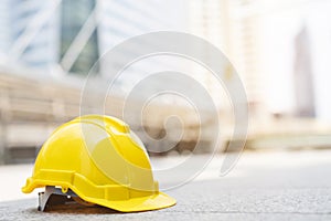 Yellow hard safety wear helmet hat in the project at construction