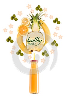 yellow healthy smoothie fruits in glass bottle