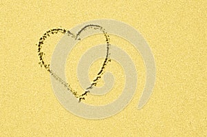 Yellow Heart in clean slightly sparkling background. Celebration of love, spring, wedding, romance, baby, nursery or baby shower.