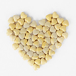 Yellow heart shaped pills