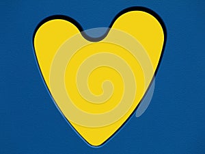 Yellow heart symbol in blue cut out toy panel