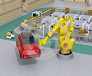 Yellow heavyweight robotic arm carrying red SUV in the assembly factory