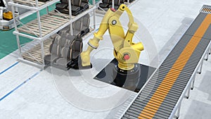 Yellow heavyweight robotic arm carrying vehicles seats for assembly