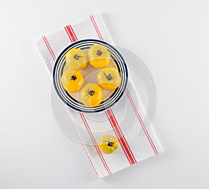 Yellow Heirloom Tomatoes on Stoneware Plate