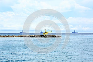 Yellow helicopter on the pier