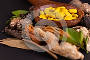 Yellow herbal pills shot with a single point focus in macro mode. Herbal medicines concept