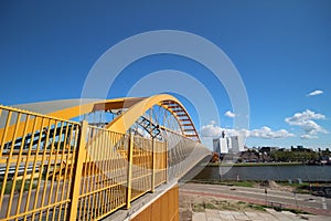 Yellow Hogeweidebrug suspension bridge in Utrecht with seperate lanes for traffic and for busses