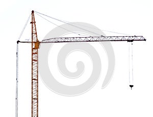 Yellow hoisting crane with dark boom