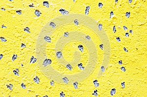 Yellow holed wall surface