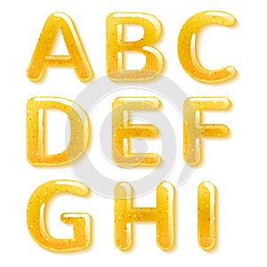 Yellow honey jelly alphabet. Glossy letters