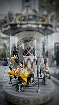 Yellow horse on carousel in lunapark