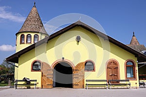 Yellow horse stable on farm