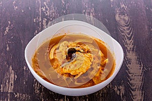 Yellow hot sour soup with preserved bamboo shoot and fish
