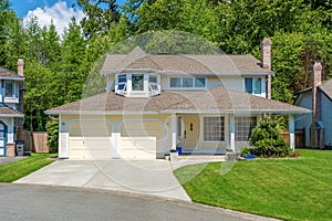 Yellow house with beautiful landscaping