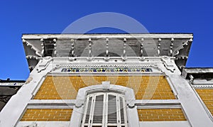 Yellow house facade white tiles in downtown Petropolis, Brazil