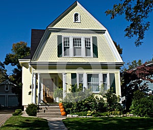 Yellow House with Pumpkins