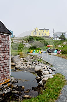 Yellow House with Red Fishing Shack on a Calm Bay