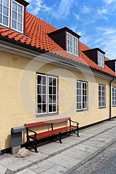 Yellow house with red roof