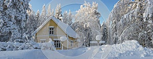 A yellow house.Winter in Lapland, Sweden, Norrbotten photo