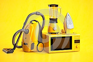 Yellow household appliances on yellow background. Set of home  technics