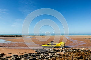 yellow hovercraft at a beautiful beach in broom, western australia
