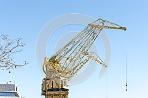 Yellow inactive historical cranes, in Puerto Madero, Buenos Aires, Argentina