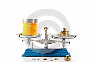 yellow ink in glass bottle on weight scale