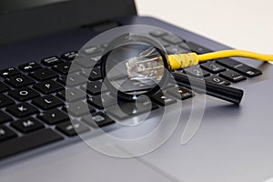 Yellow internet switch , magnifying glass close up macro shot on laptop computer