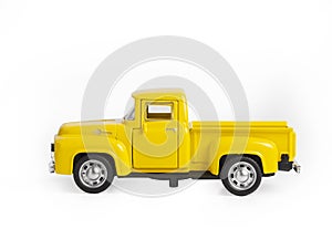 yellow iron toy car the truck isolated on a white background