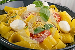 Yellow italian pasta pappardelle, fettuccine or tagliatelle