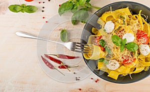 Yellow italian pasta pappardelle, fettuccine or tagliatelle