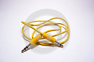 Yellow jack audio cable 3.5 mm male to male on white background