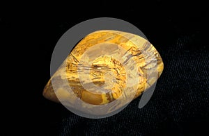 Yellow Jasper Stone against Black Background