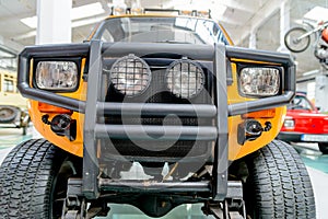 Yellow jeep with protective bumper and headlights