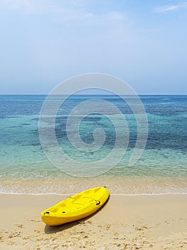 Yellow Kayak boat on tropical island beach bright sun in summer. Koh Kood - Thailand