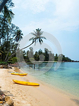 Yellow Kayak boat on tropical island beach bright sun in summer. Koh Kood - Thailand