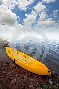 Yellow kayak in the lake