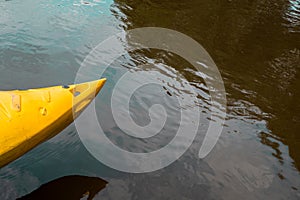 yellow kayak on a river - summer daytrip adventure