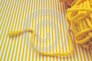 Yellow knitting yarn background