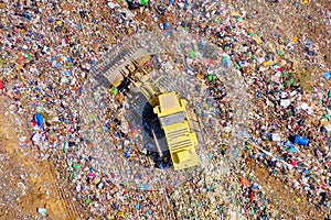 Yellow Landfill compactor at Municipal Solid waste compound.