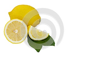 Yellow lemon citrus fruit and green leaves