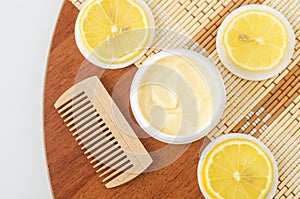 Yellow lemon facial mask banana face cream, shea butter hair mask, body butter in the small white container. Natural skin care