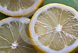 Yellow lemon rings close up, top view.