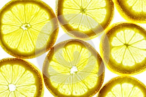 Yellow lemon slices isolated on a white background