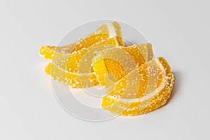 Yellow lemon slices from marmalade with sugar