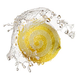Yellow lemon in splash of water