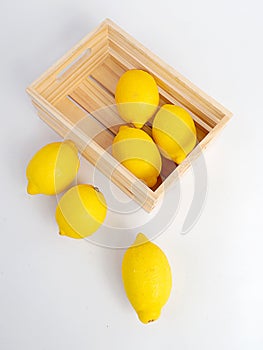 Yellow lemon and wood box