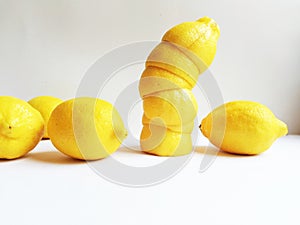 Yellow lemons and lemon peels