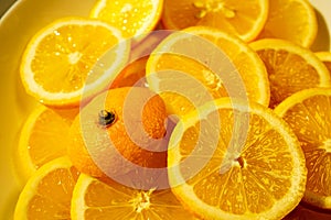 yellow lemons on a plate on a sunny day photo